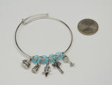 Paradise Parrot Head Wire Bracelet with Five Charms and Blue Beads B-JBBR